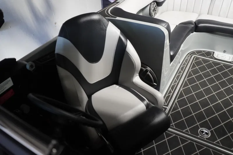 Slide: The Image of 2024 MB B52 23 Classic boat interior with black and white seating and patterned flooring. - 34