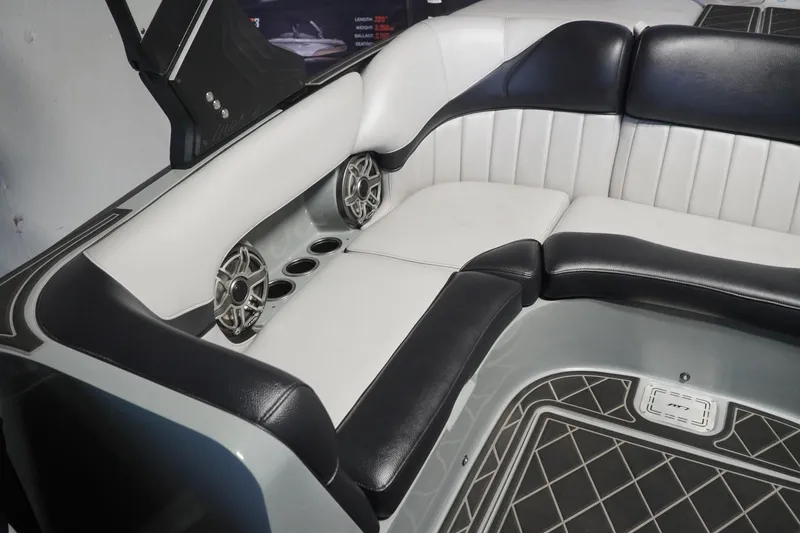 Slide: The Image of 2024 MB B52 23 Classic boat interior with black and white seating and built-in speakers. - 36