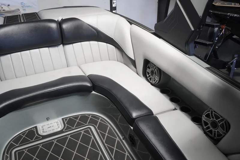 Slide: The Image of 2024 MB B52 23 Classic boat interior with black and white seating and built-in speakers. - 38