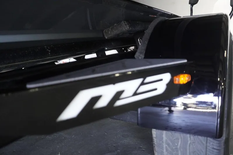 Slide: The Image of 2024 MB B52 23 Classic trailer detail with M3 logo and tire. - 4