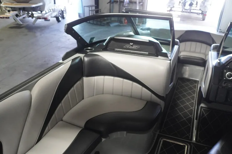 Slide: The Image of 2024 MB B52 23 Classic boat interior with black and white seating and modern design. - 40