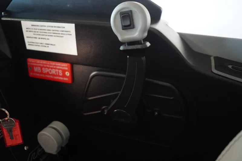 Slide: The Image of Interior of 2024 MB B52 23 Classic boat with control lever and key. - 49