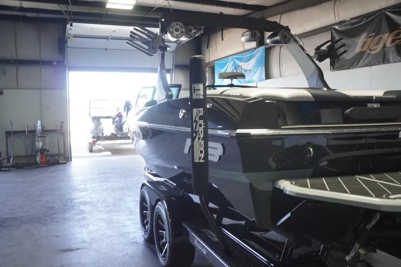 Slide: The Image of 2024 MB B52 23 Classic boat in a garage, showcasing sleek design and modern features. - 7