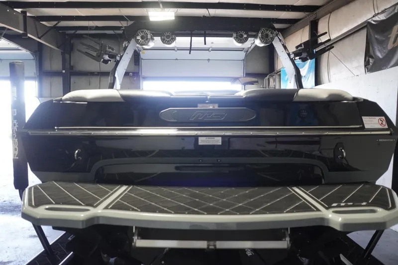 Slide: The Image of 2024 MB B52 23 Classic boat rear view in a garage setting. - 8