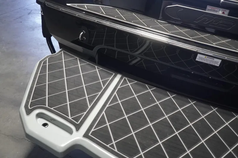 Slide: The Image of 2024 MB B52 23 Classic boat with diamond-patterned deck design. - 9