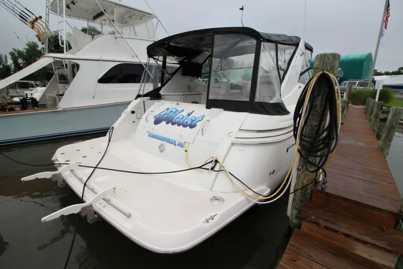 Slide: The Image of 2002 Cruisers Yachts 4270 Express docked at marina, rear view. - 13