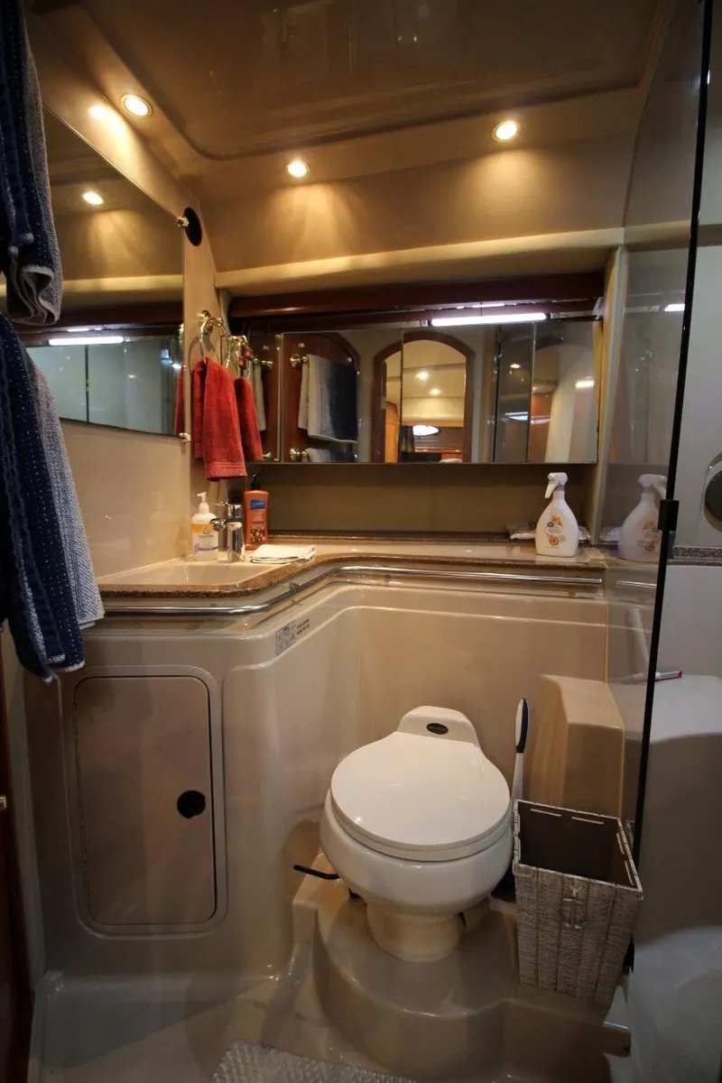 Slide: The Image of Luxurious bathroom in 2002 Cruisers Yachts 4270 Express with modern amenities. - 27