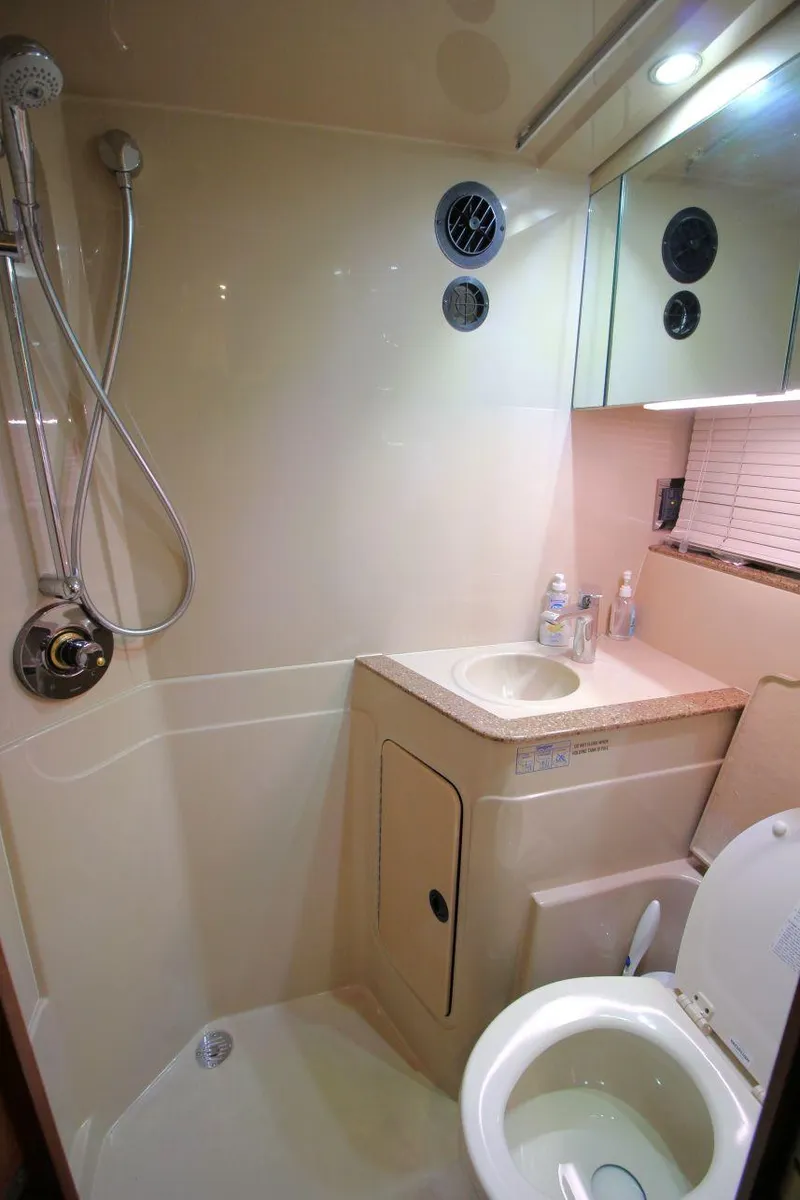 Slide: The Image of Bathroom interior of 2002 Cruisers Yachts 4270 Express with shower and sink. - 31