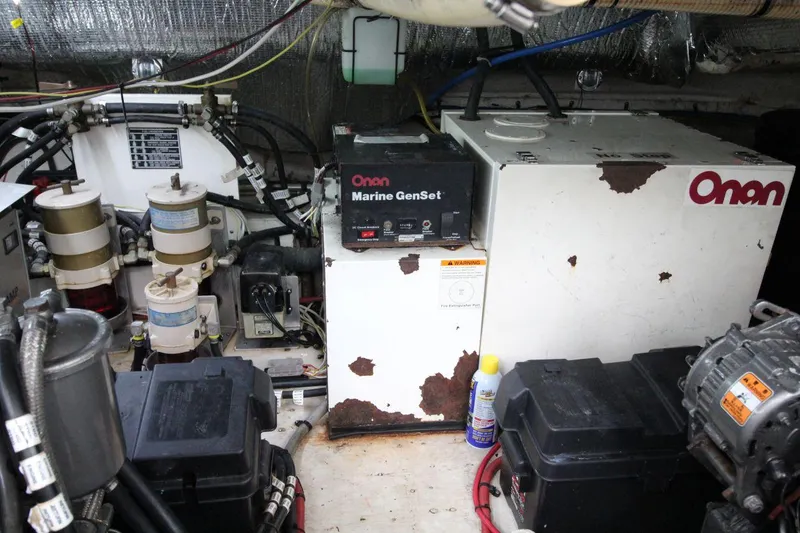 Slide: The Image of Engine room of 2002 Cruisers Yachts 4270 Express with Onan Marine GenSet. - 33