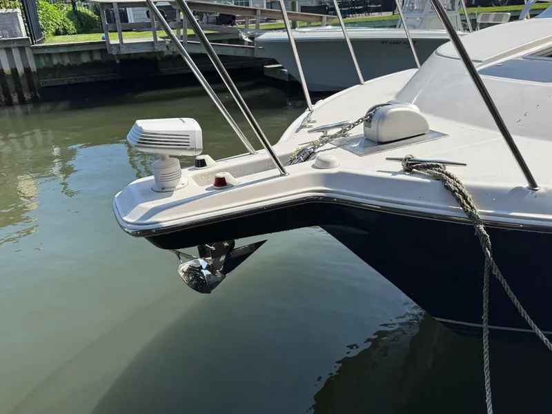 Slide: The Image of 2005 Wellcraft 290 Coastal boat docked, showing bow details and anchor. - 19