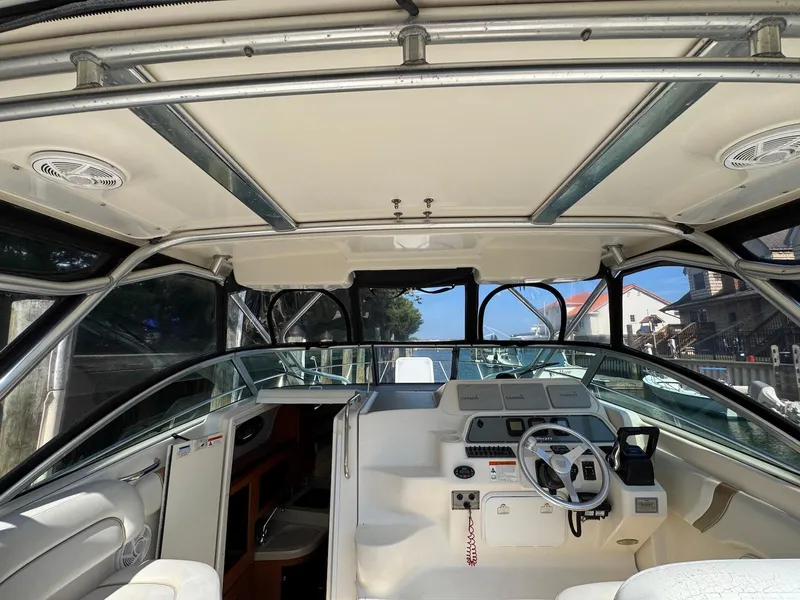Slide: The Image of 2005 Wellcraft 290 Coastal boat interior with steering wheel and control panel. - 20