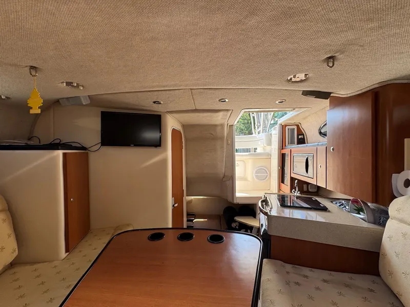 Slide: The Image of Interior of 2005 Wellcraft 290 Coastal boat with cozy seating and modern amenities. - 22