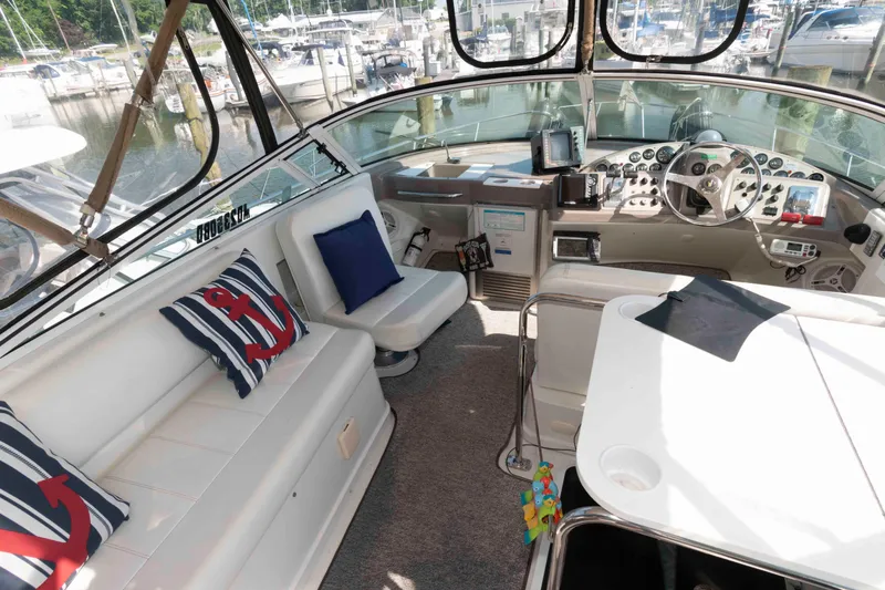 Slide: The Image of Interior of a 1997 Carver 350 Mariner yacht with nautical-themed decor. - 9