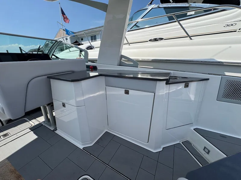 Slide: The Image of 2023 Aviara AV32 OB boat interior with sleek cabinetry and modern design. - 11