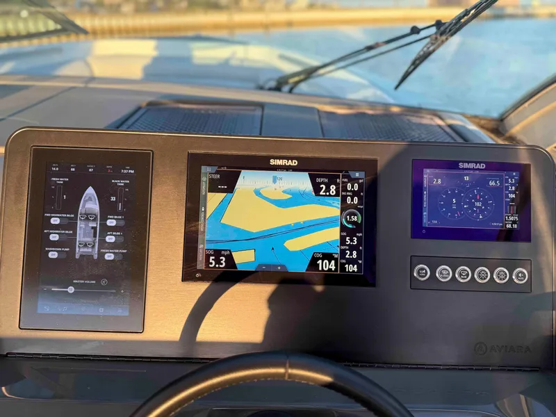 Slide: The Image of Dashboard of 2023 Aviara AV32 OB boat with Simrad navigation displays. - 13