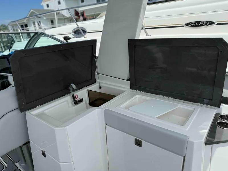 Slide: The Image of 2023 Aviara AV32 OB boat interior with open storage compartments and sleek design. - 16