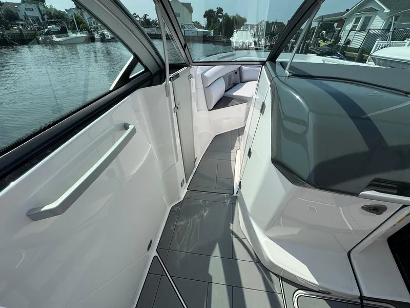 Slide: The Image of 2023 Aviara AV32 OB boat interior with sleek design and waterfront view. - 24