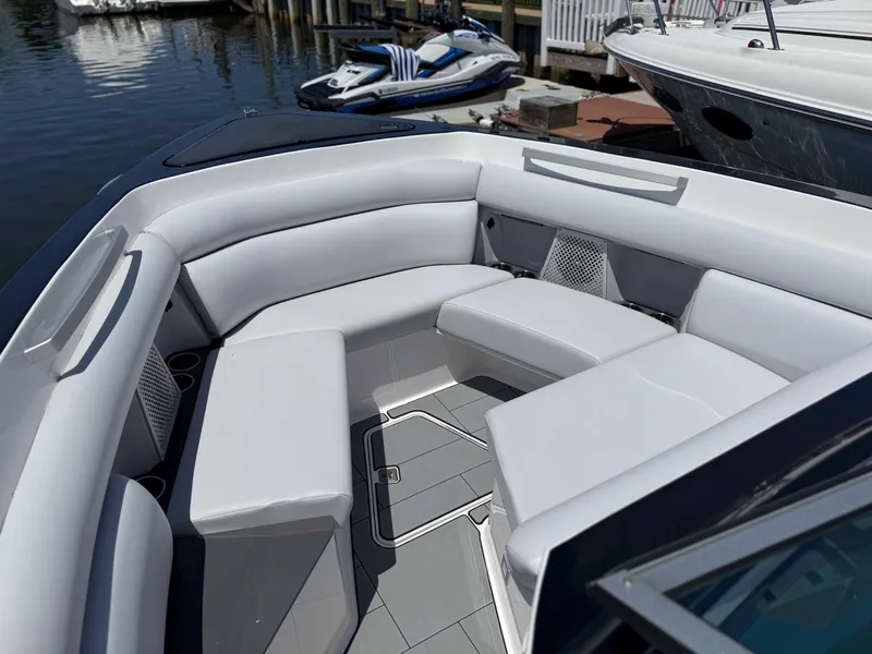 Slide: The Image of 2023 Aviara AV32 OB boat interior with sleek white seating and modern design. - 5