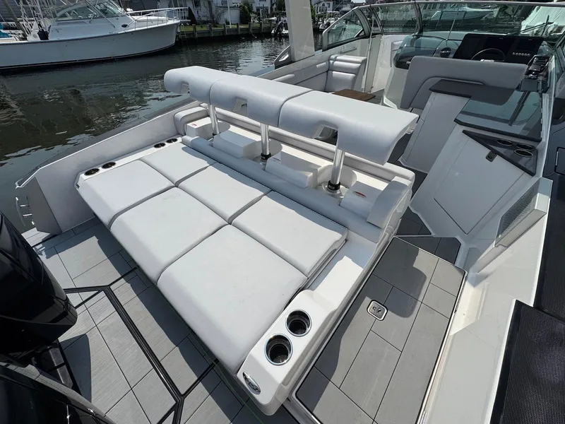 Slide: The Image of 2023 Aviara AV32 OB luxury boat with spacious seating and sleek design. - 9