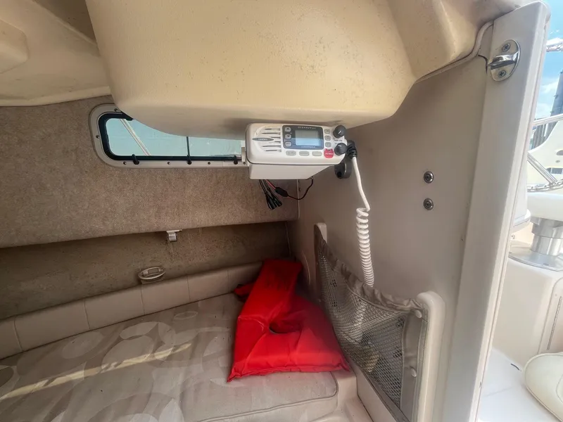 Slide: The Image of Interior cabin of 2006 Grady-White Adventure 208WA with radio and red life jacket. - 18