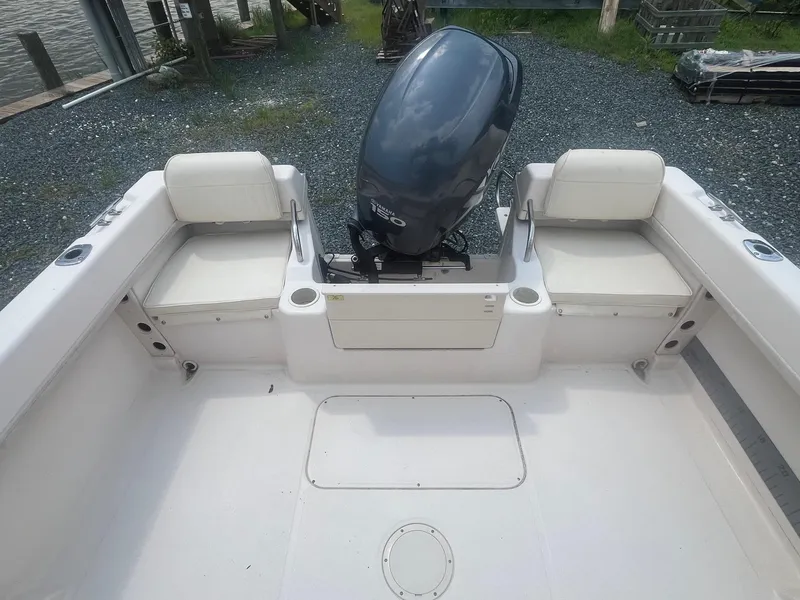 Slide: The Image of 2006 Grady-White Adventure 208WA boat interior with Yamaha outboard motor. - 20
