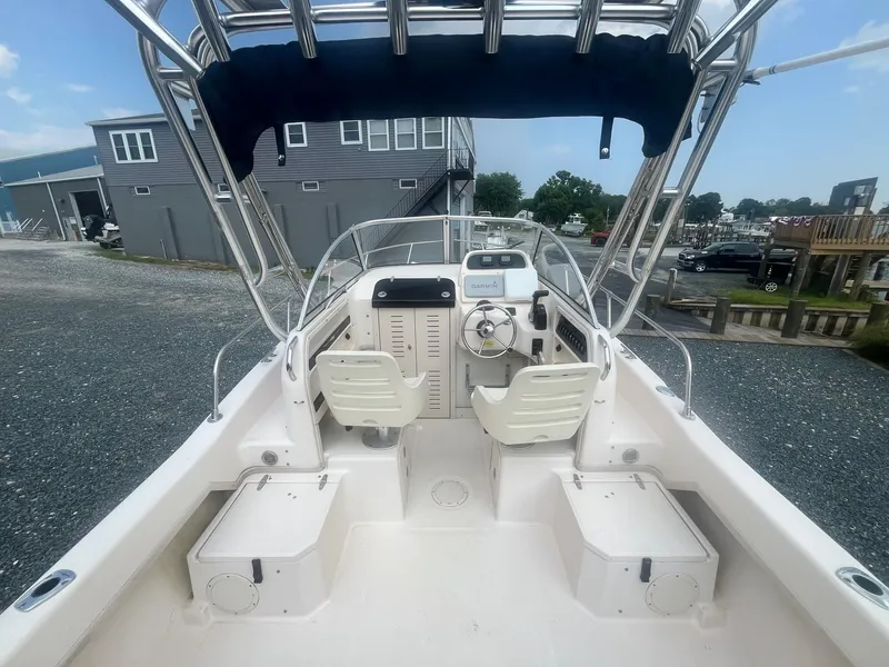 Slide: The Image of 2006 Grady-White Adventure 208WA boat interior with steering wheel and seating. - 9