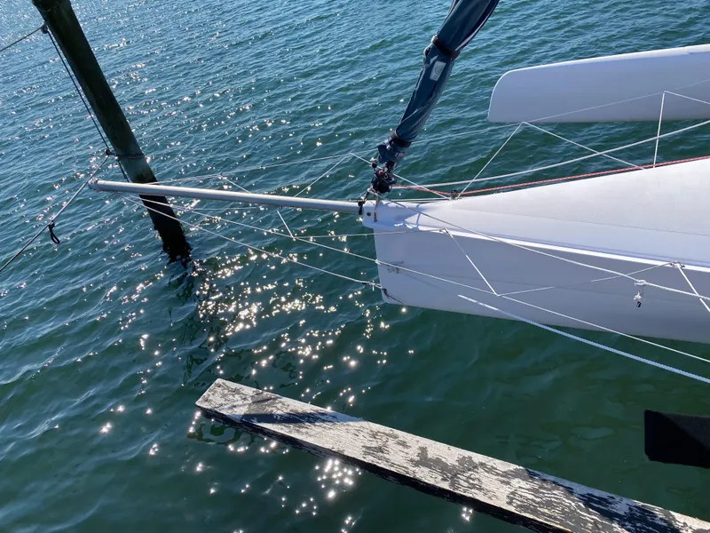 Slide: The Image of Trimaran SeaRail 19 sailboat on water, 2014 model, with sparkling reflections. - 6
