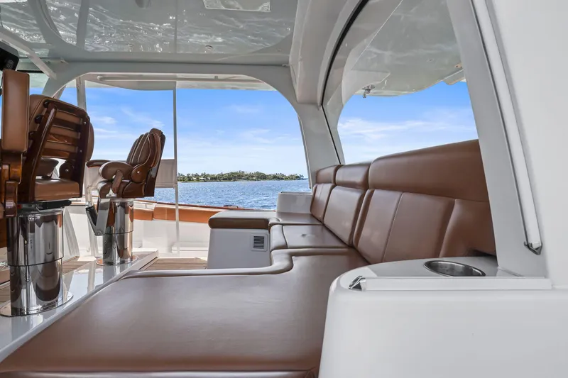 Slide: The Image of Luxurious interior of 2023 HCB 65 Estrella yacht with leather seating and ocean view. - 13