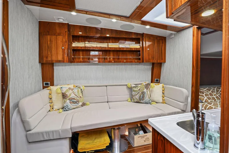 Slide: The Image of Luxurious interior of 2023 HCB 65 Estrella yacht with plush seating and elegant wood finishes. - 38