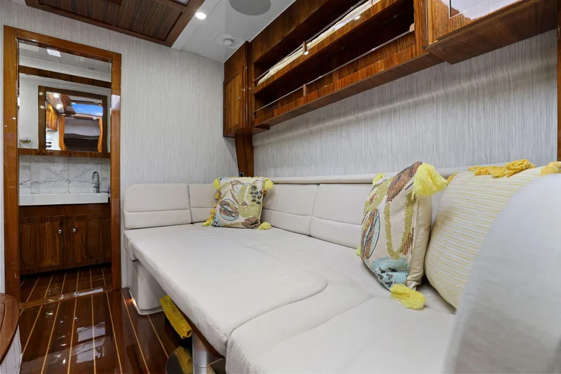 Slide: The Image of Luxurious interior of 2023 HCB 65 Estrella yacht with plush seating and elegant wood finishes. - 39
