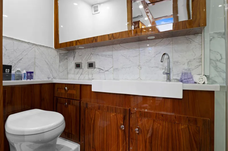 Slide: The Image of Luxurious bathroom in 2023 HCB 65 Estrella yacht with marble and wood finishes. - 46