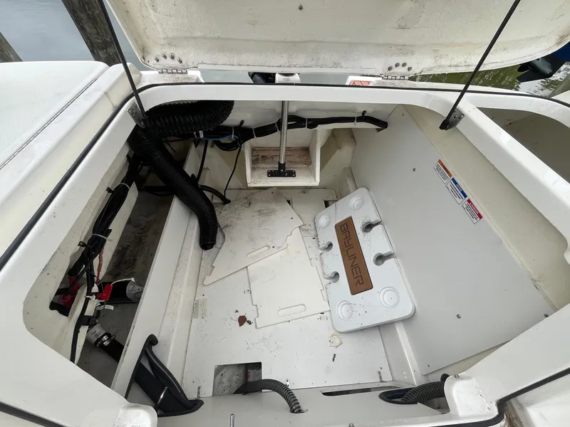 Slide: The Image of 2023 Bayliner VR6 Bowrider OB engine compartment, showcasing interior components and storage space. - 6