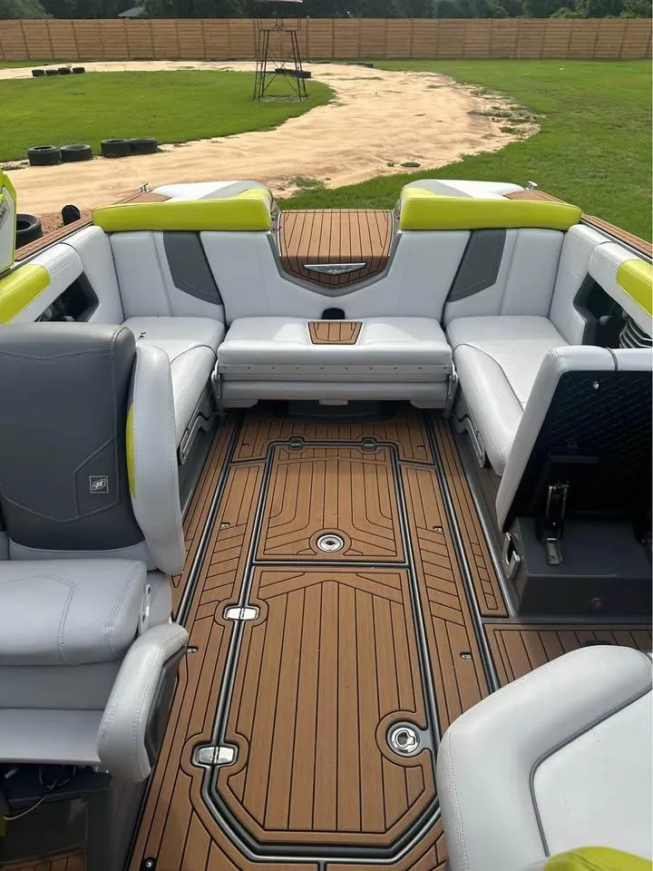 Slide: The Image of 2017 Nautique Super Air Nautique G23 interior with luxurious seating and teak flooring. - 2