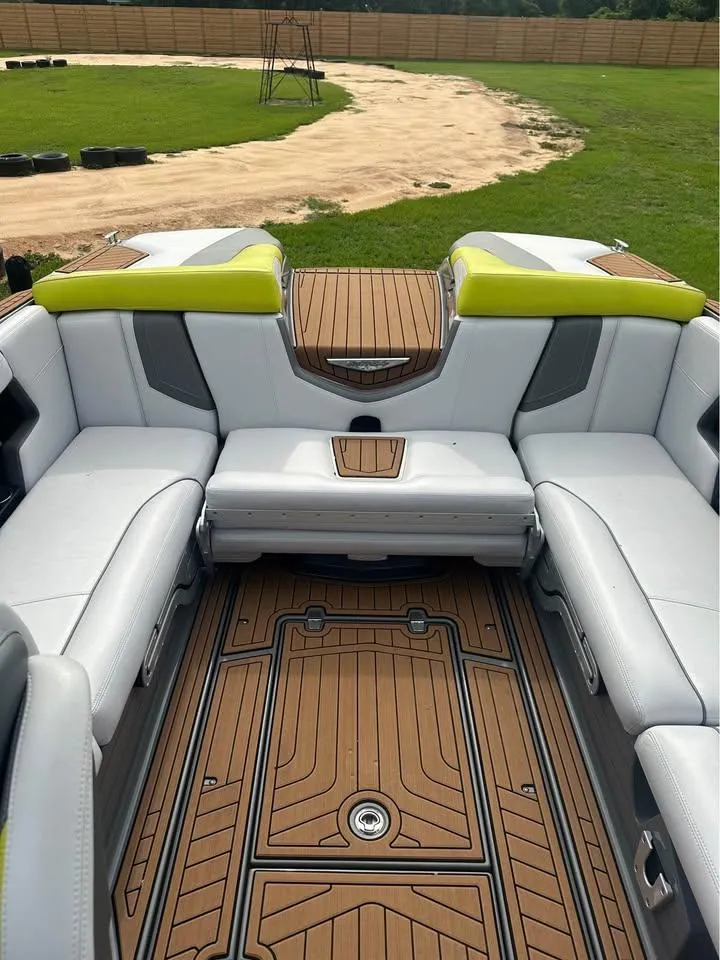Slide: The Image of 2017 Nautique Super Air Nautique G23 interior with white seating and teak flooring. - 5