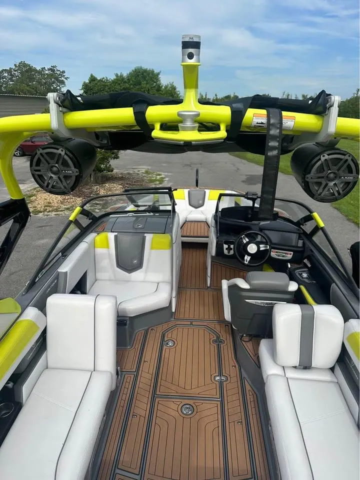 Slide: The Image of 2017 Nautique Super Air Nautique G23 interior with sleek seating and vibrant accents. - 6
