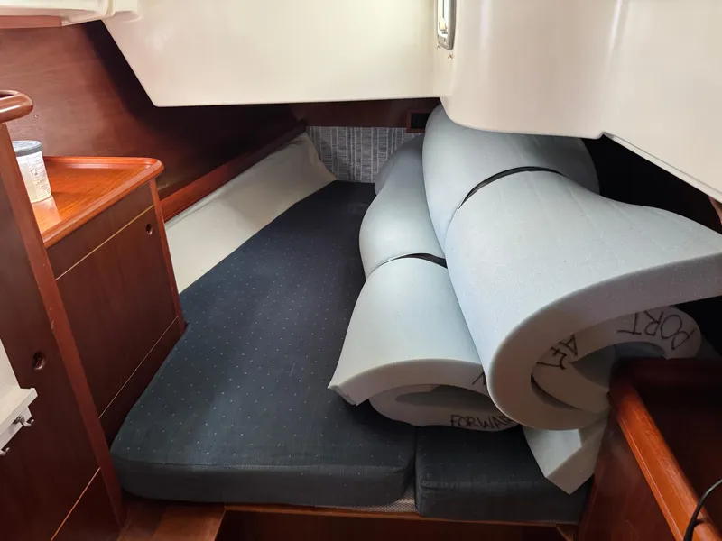 Slide: The Image of Interior cabin of 1997 Beneteau Oceanis 461 with rolled foam cushions. - 13