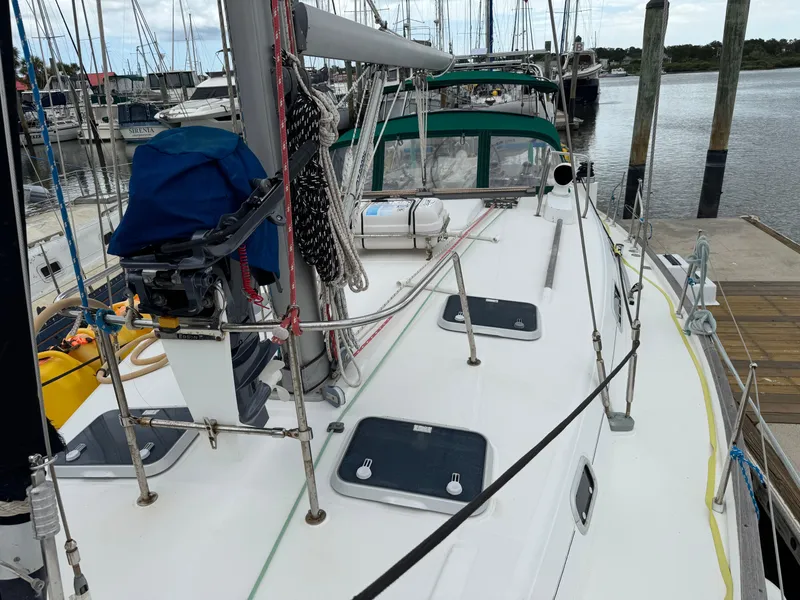 Slide: The Image of 1997 Beneteau Oceanis 461 sailboat docked at marina, showcasing deck and rigging. - 24