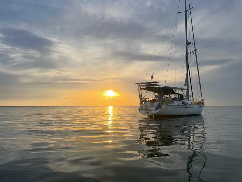 Slide: The Image of Beneteau Oceanis 461 sailboat on calm sea at sunset, 1997 model. - 37