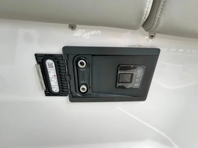 Slide: The Image of Control panel on 2025 Monterey Elite 30 OB boat, featuring inflate and deflate options. - 11