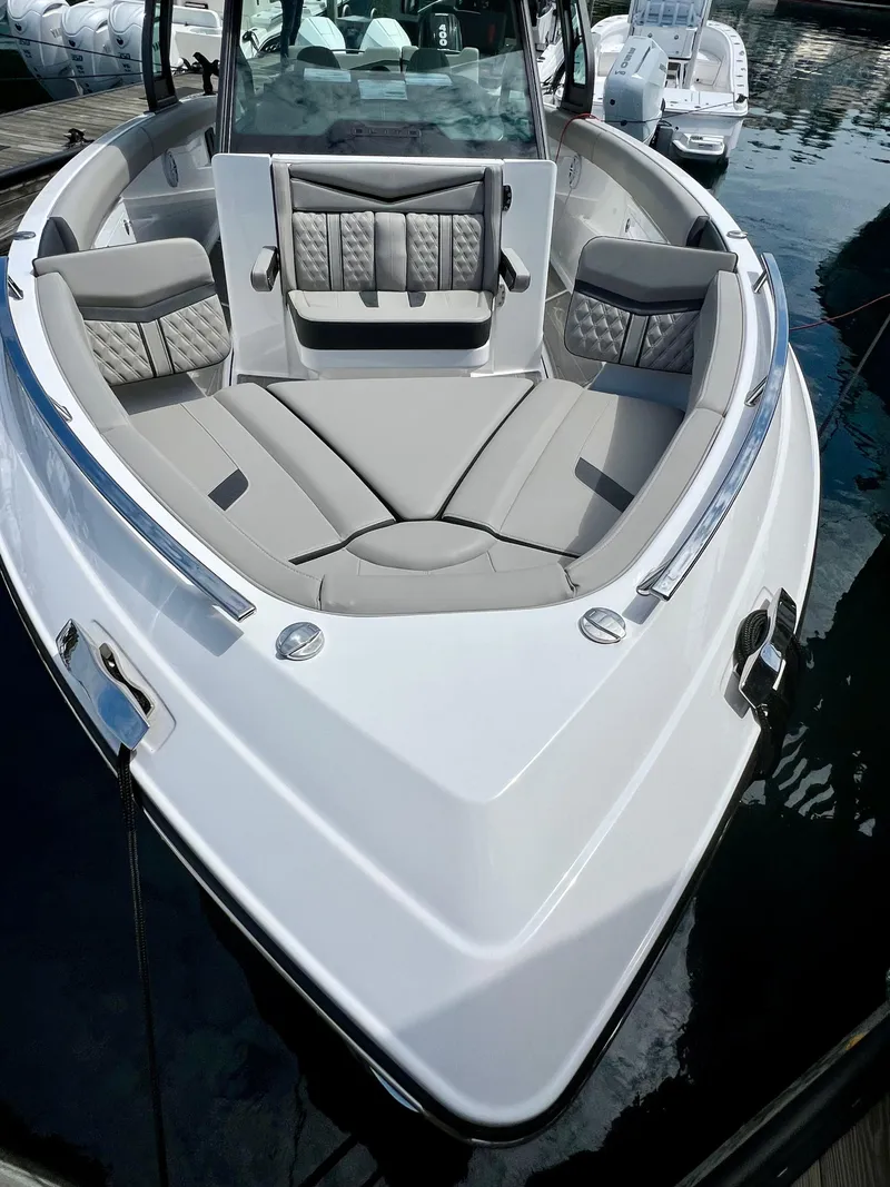 Slide: The Image of 2025 Monterey Elite 30 OB boat with luxurious seating and sleek design. - 8