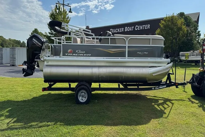 Slide: The Image of 2025 Sun Tracker Party Barge 18 DLX pontoon boat on trailer at Tracker Boat Center. - 9