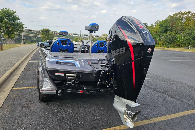 Slide: The Image of 2025 Ranger Z519R Cup-Equipped boat with powerful V8 engine, parked near a scenic river. - 4