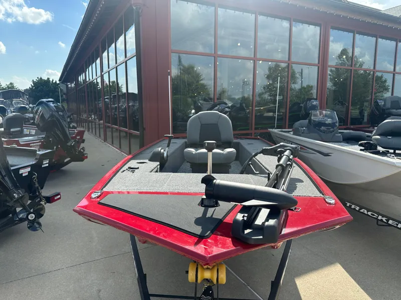 The Image of 2025 Tracker Panfish 17 boat with red exterior displayed outdoors. - 0