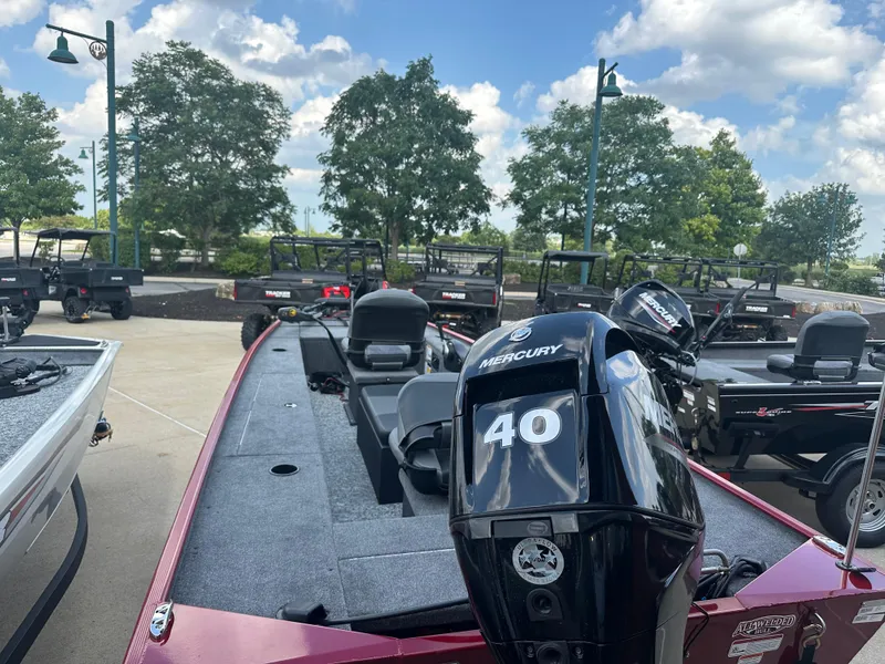 Slide: The Image of 2025 Tracker Panfish 17 boat with Mercury 40 engine, parked outdoors. - 3