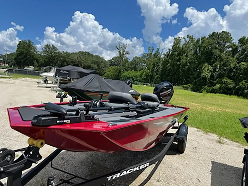 The Image of 2025 Tracker Panfish 17 boat on trailer under a clear blue sky. - 0
