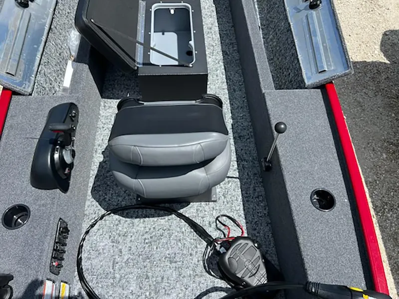 Slide: The Image of Interior of 2025 Tracker Panfish 17 boat with seating and control panel. - 7