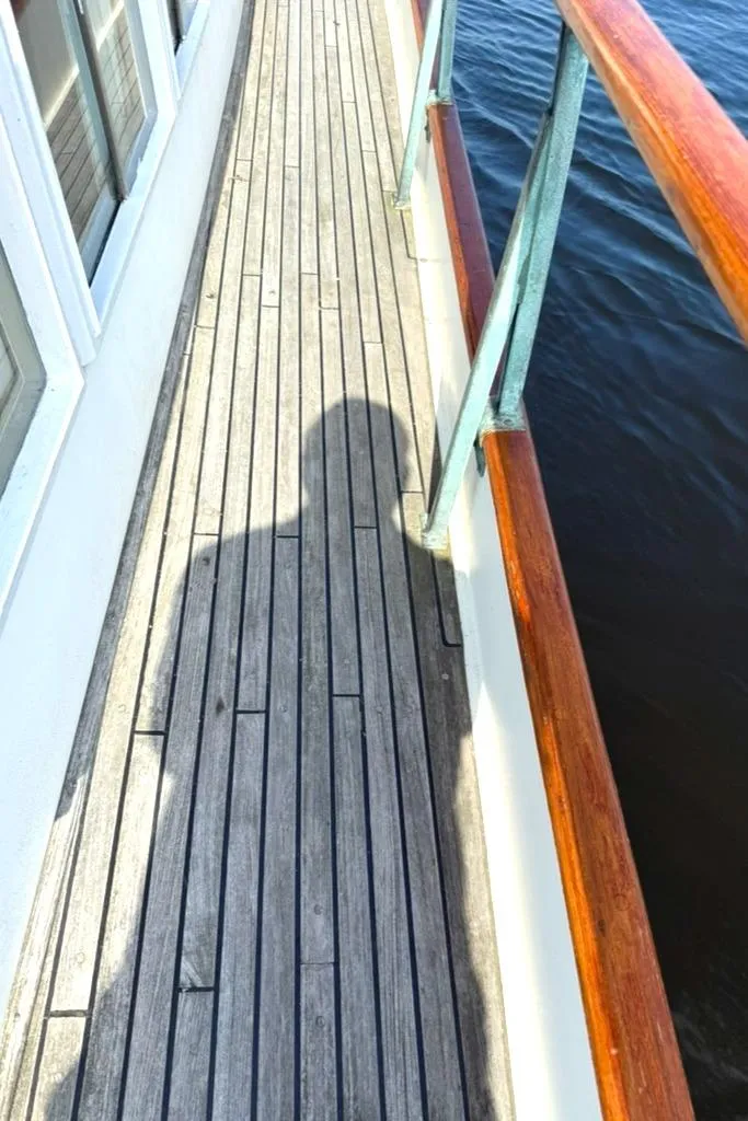 Slide: The Image of Shadow on the deck of a 1981 Grand Banks 36 Classic boat. - 12