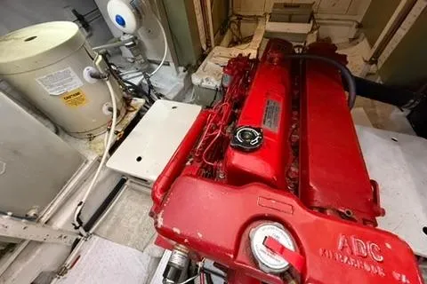 Slide: The Image of Engine room of 1981 Grand Banks 36 Classic with red engine and equipment. - 32