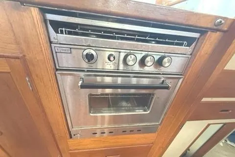 Slide: The Image of Stainless steel oven in 1981 Grand Banks 36 Classic yacht kitchen. - 38