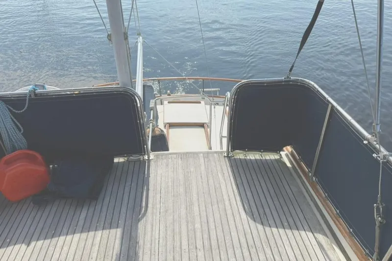 Slide: The Image of 1981 Grand Banks 36 Classic yacht deck with ocean view and nautical equipment. - 7